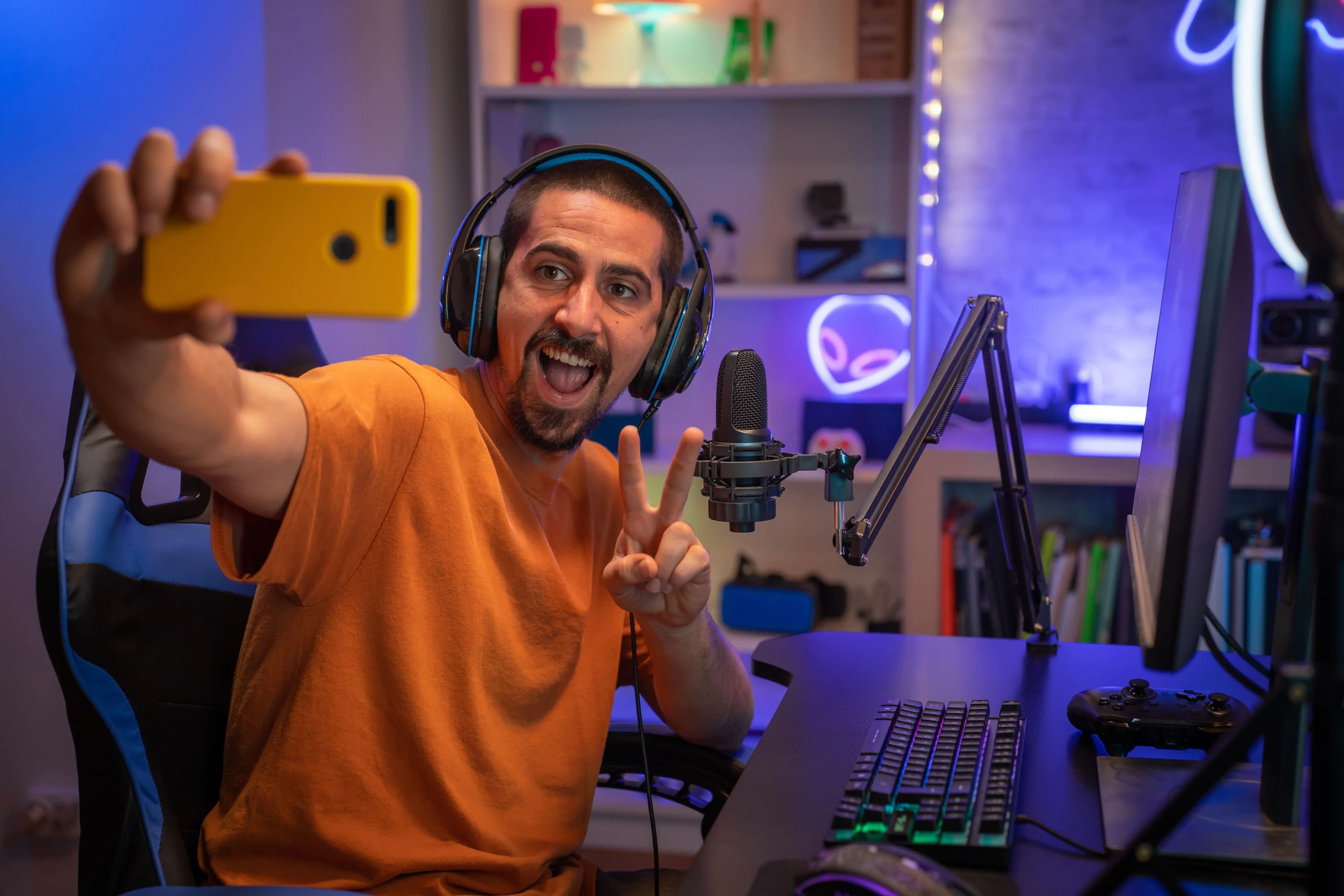 Twitch streamer and gamer in professional gaming setup building successful fashion merchandise business