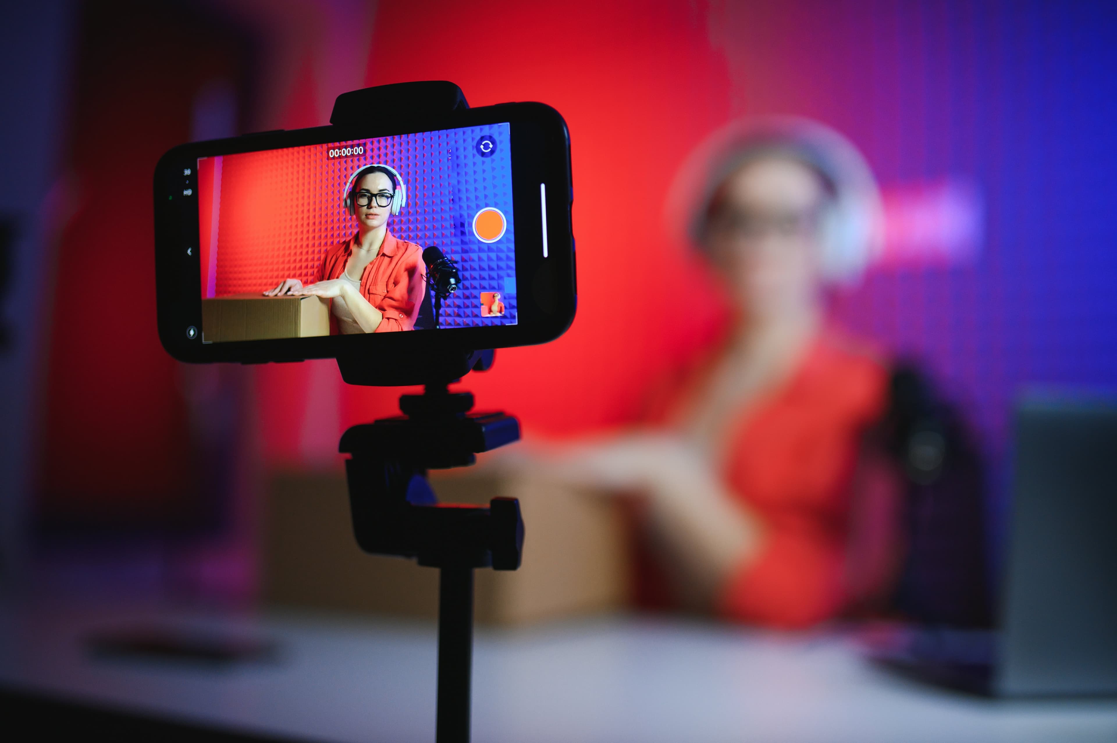 YouTube creator fashion innovation - Pluck Reach creator services YouTube creator and gamer taking selfie in professional gaming setup while building fashion business