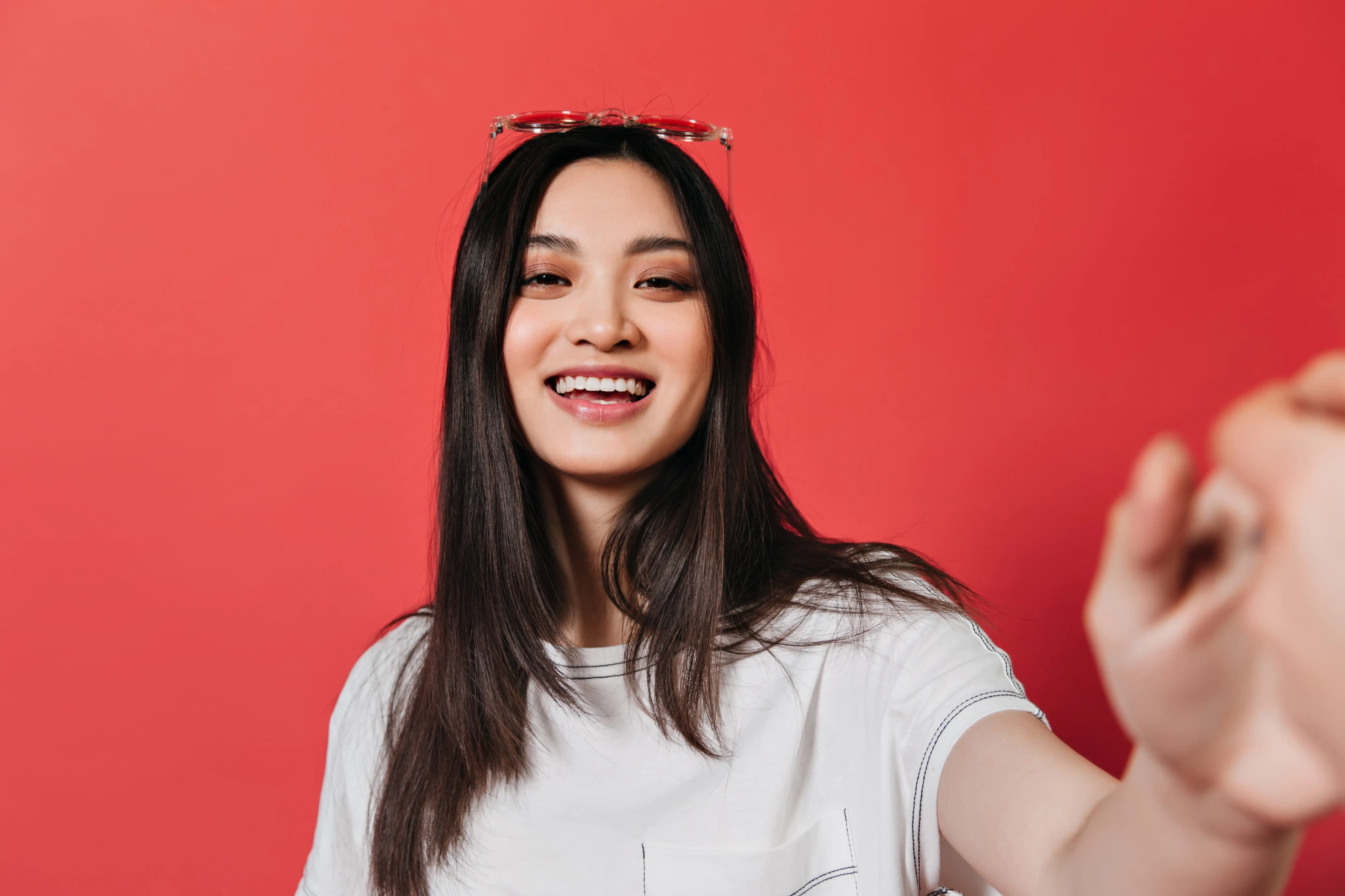 TikTok creator fashion innovation - Pluck Reach creator services Optimistic TikTok creator smiling and creating content while building successful fashion business
