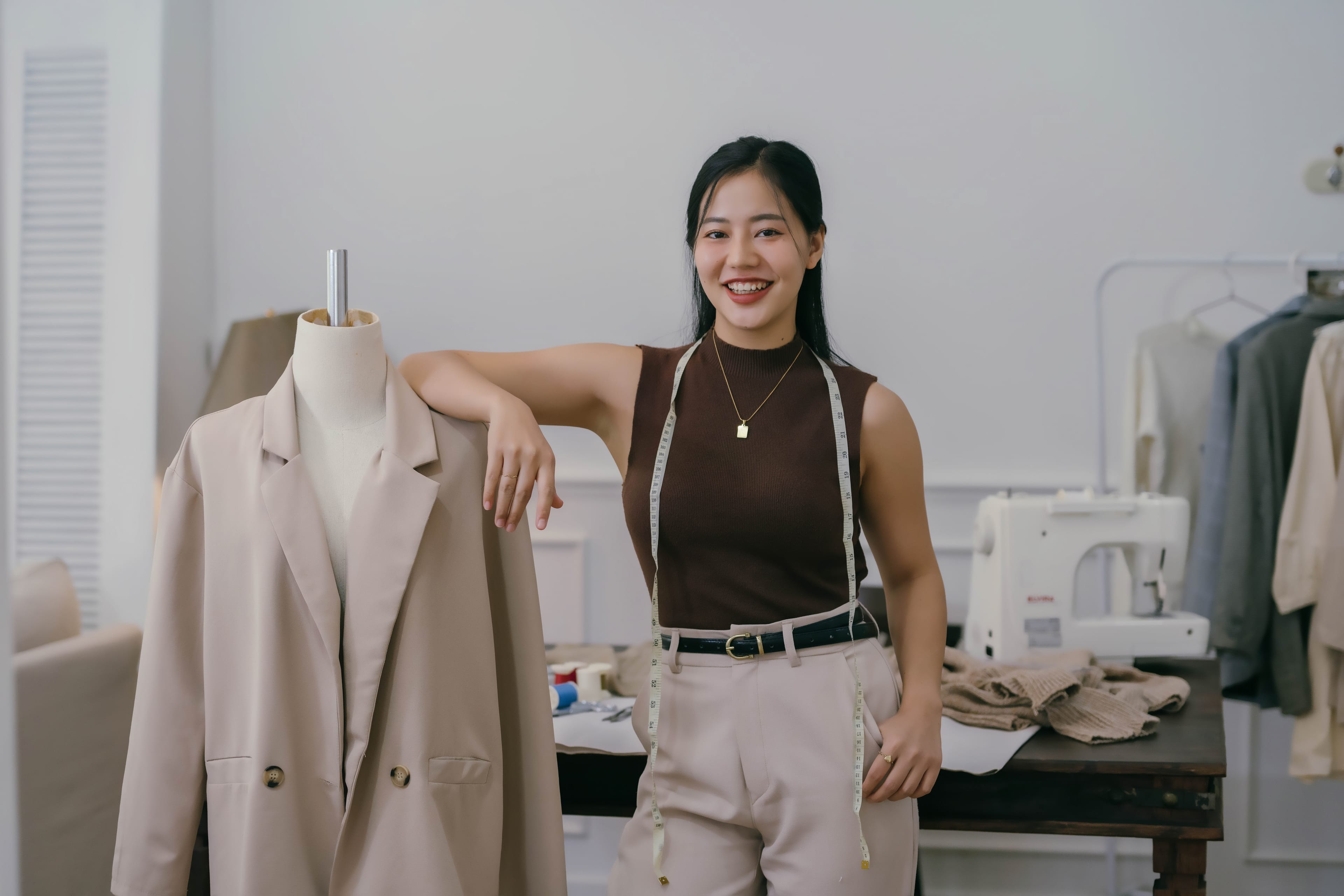Happy fashion entrepreneurs with their clothing brand products